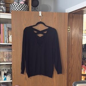 Black V-Neck Sweater with Cozy Knit Fabric and Stylish Back Detail